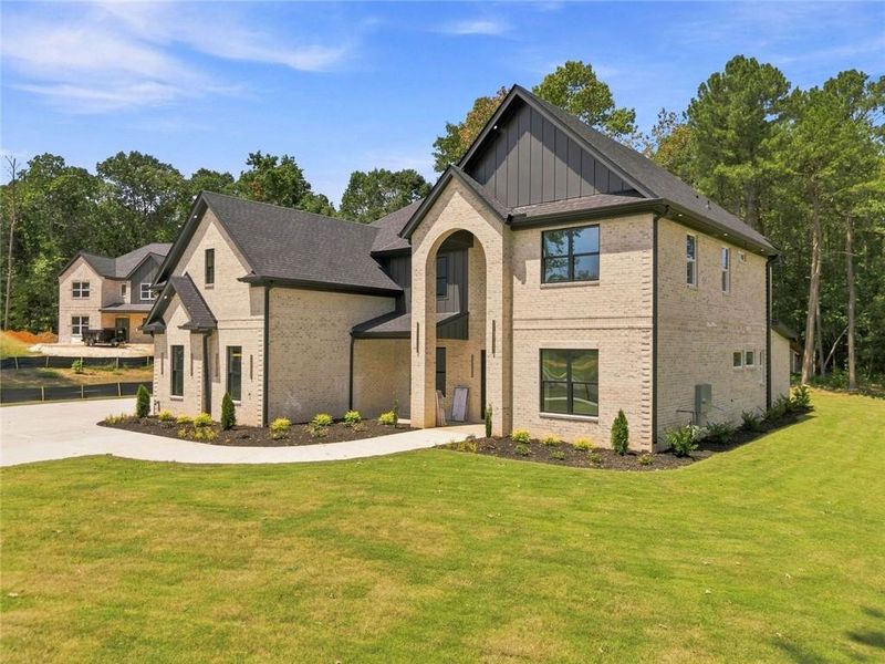 Front exterior of a new home in , Loganville, GA, highlighting curb appeal (Image 27).