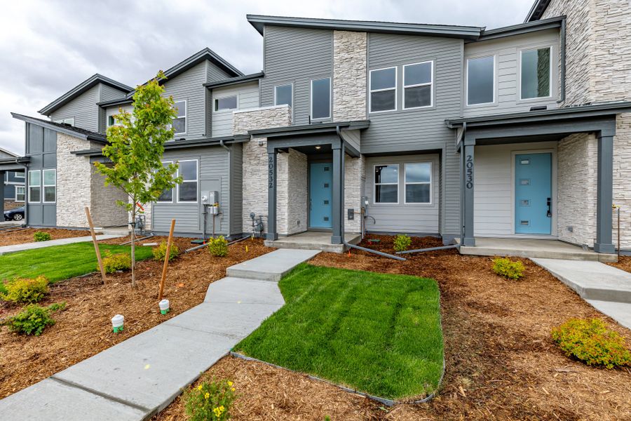 Front exterior of a new home in Painted Prairie, Aurora, CO, highlighting curb appeal (Image 2). Front exterior of a new home in Painted Prairie, Aurora, CO, highlighting curb appeal (Image 2).