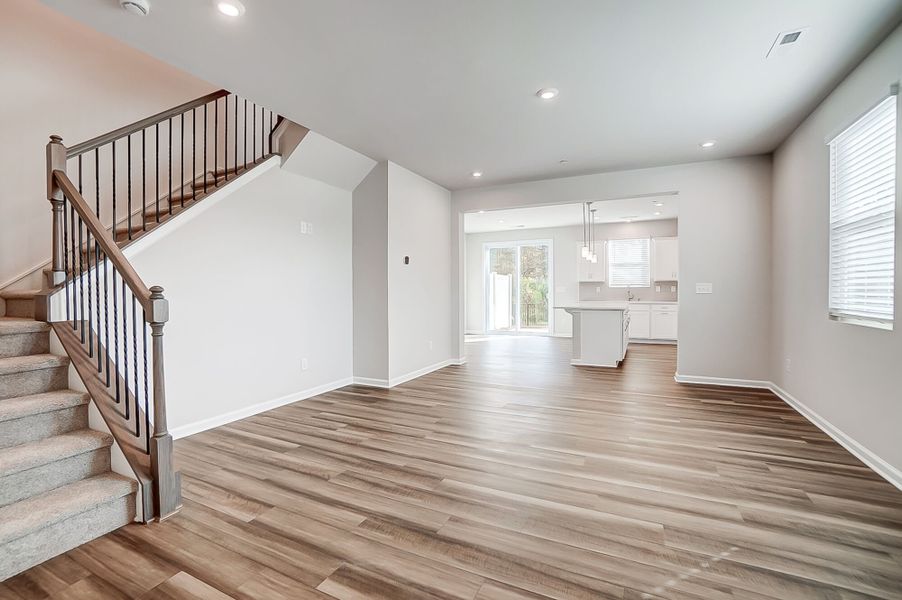 Gathering room with kitchen beyond