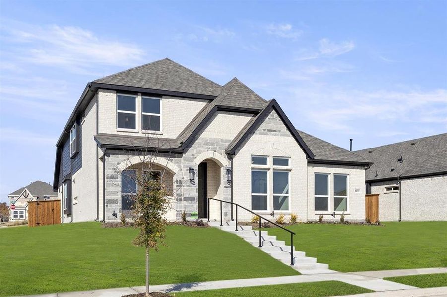 Front exterior of a new home in Trails at Cottonwood Creek, Rowlett, TX, highlighting curb appeal (Image 2).
