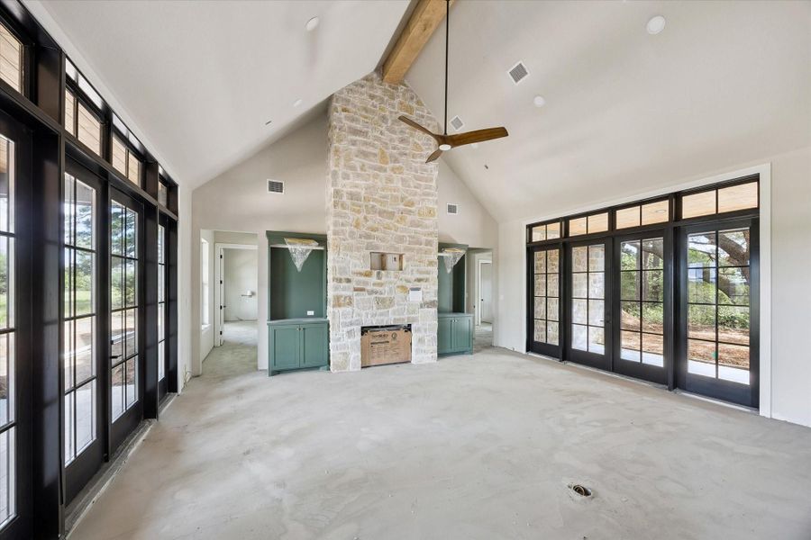 One big great room.  Vaulted ceiling, maple beam, beautiful French doors with transoms above.