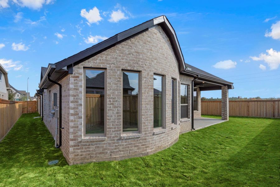 Exterior details and patio area of a home in Dunham Pointe 50', Cypress (Image 22).