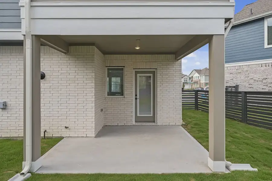 Exterior details and patio area of a home in Bridgeland Courtyard, Cypress (Image 4).