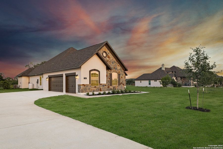 Front exterior of a new home in Potranco Acres, Castroville, TX, highlighting curb appeal (Image 24).