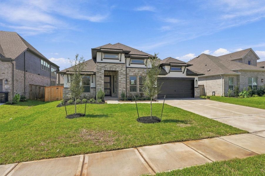 Front exterior of a new home in Coastal Point, League City, TX, highlighting curb appeal (Image 23).