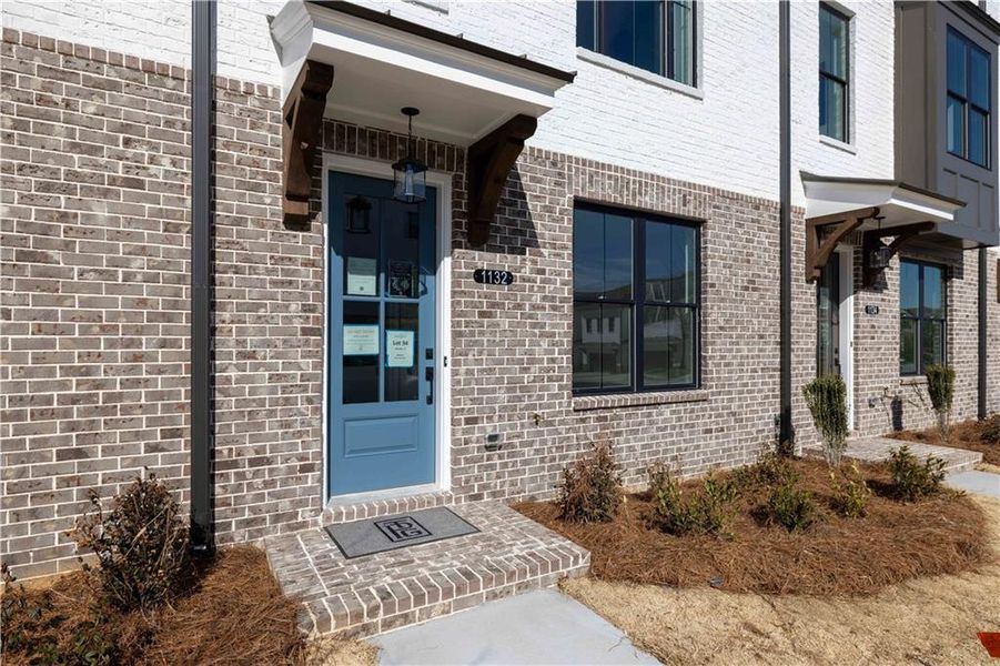 Exterior details and patio area of a home in Millcroft Townhomes, Buford (Image 24). Exterior details and patio area of a home in Millcroft Townhomes, Buford (Image 24).