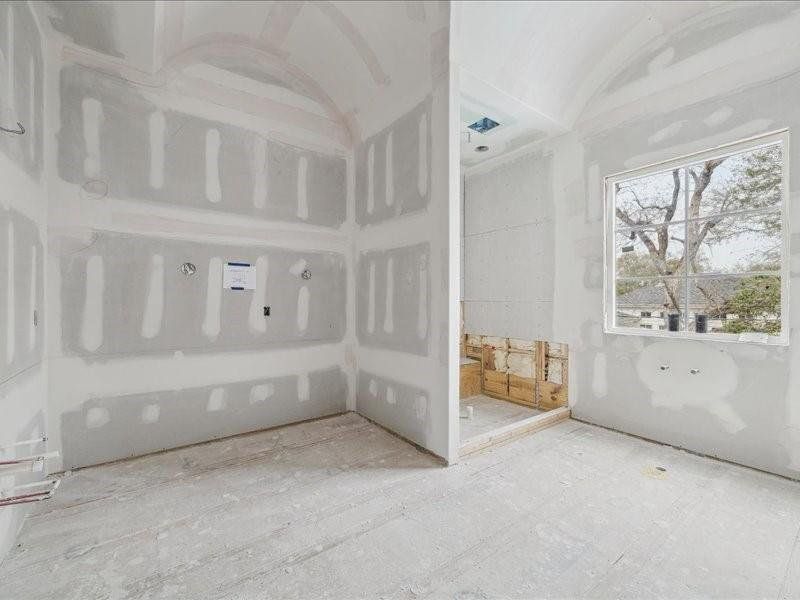 Primary Bathroom with separate tub and shower, his and her vanities