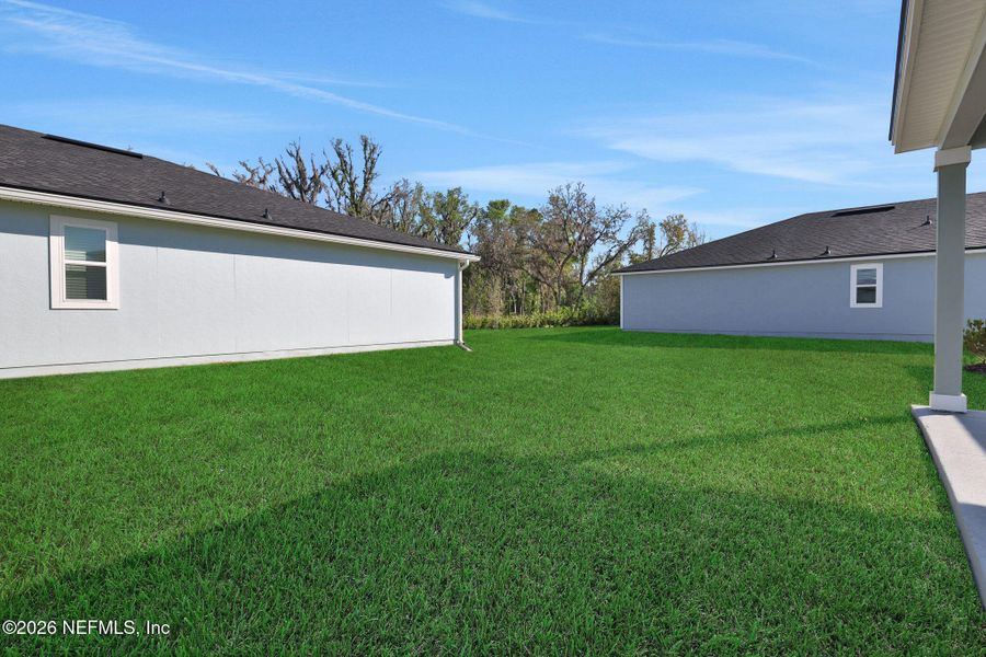 Exterior details and patio area of a home in Wilford Oaks, Orange Park (Image 28).