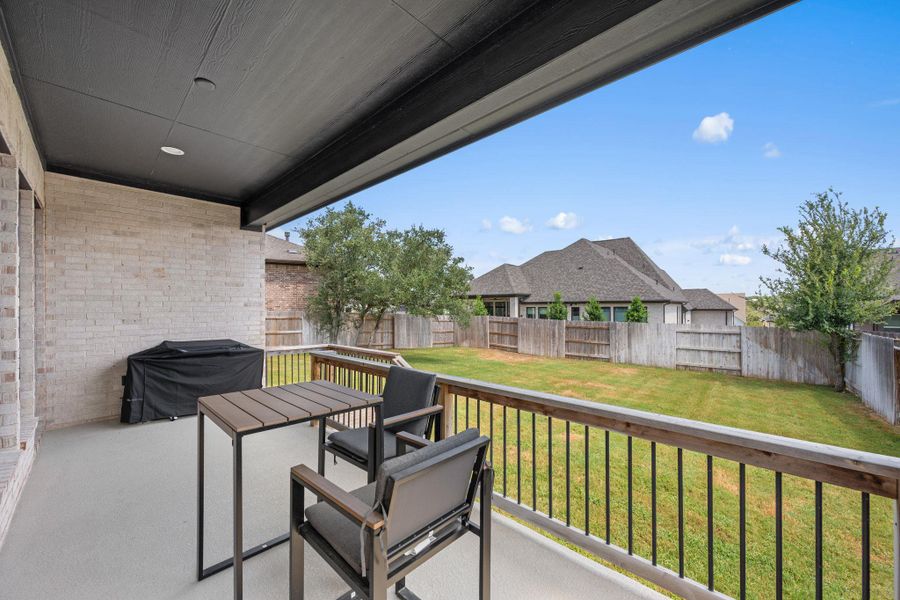 A spacious covered patio offers ample room for outdoor dining and direct access to a private, fenced backyard. A spacious covered patio offers ample room for outdoor dining and direct access to a private, fenced backyard.