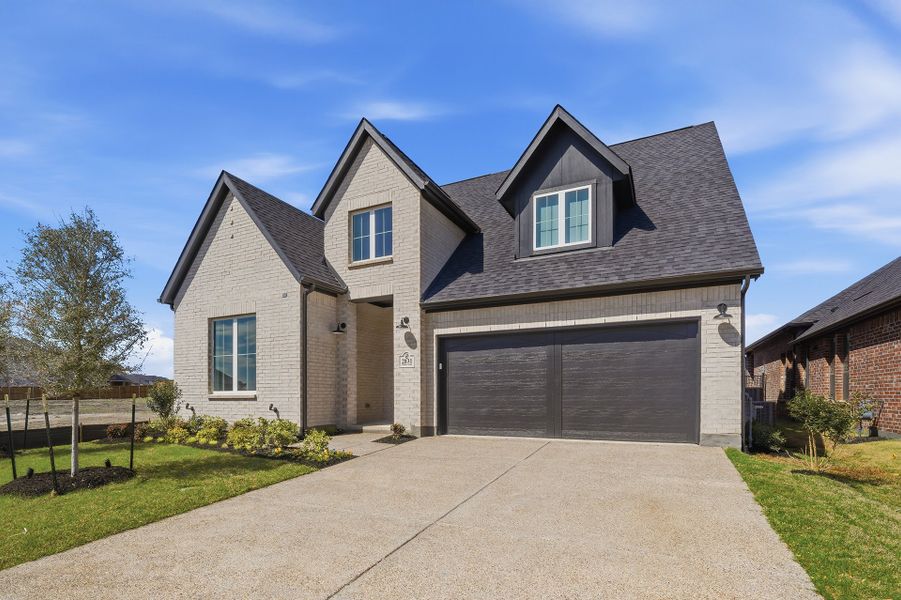 Front exterior of a new home in Brookhollow West, Prosper, TX, highlighting curb appeal (Image 25). Front exterior of a new home in Brookhollow West, Prosper, TX, highlighting curb appeal (Image 25).