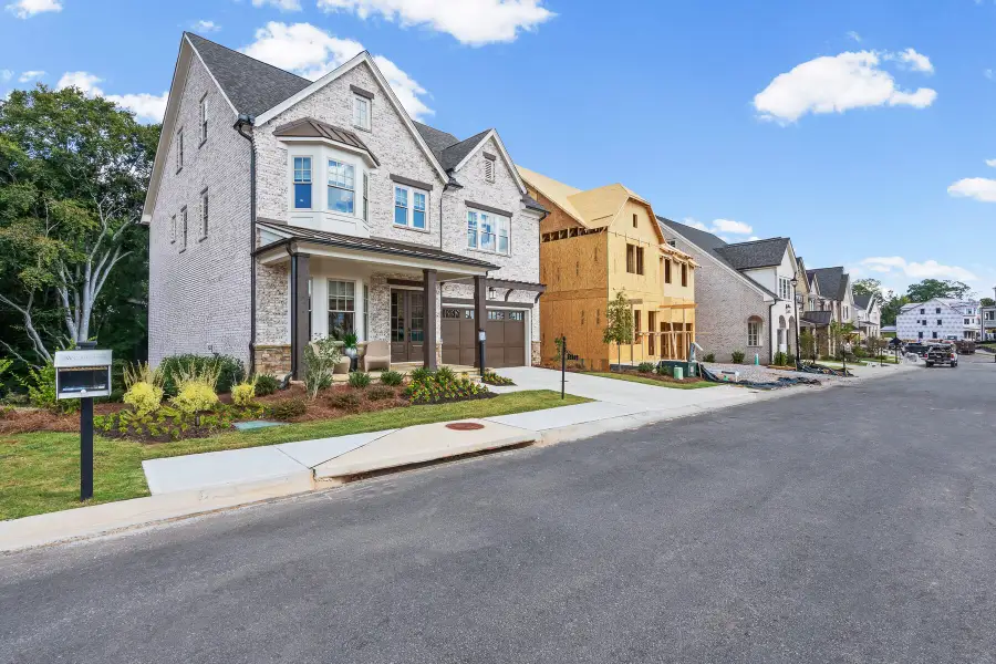 Front exterior of a new home in Laurel View, Suwanee, GA, highlighting curb appeal (Image 2). Front exterior of a new home in Laurel View, Suwanee, GA, highlighting curb appeal (Image 2).