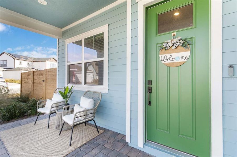 Exterior details and patio area of a home in Weslyn Park at Sunbridge (Craft Homes), St. Cloud (Image 23).