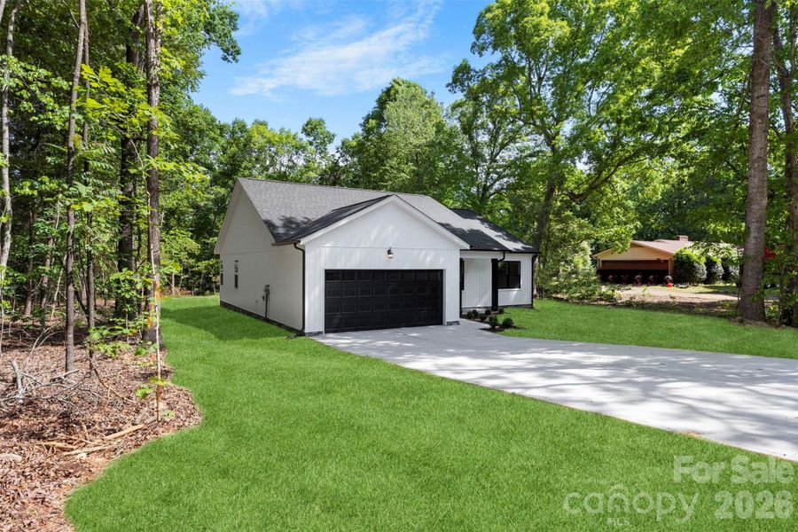 Front exterior of a new home in , Statesville, NC, highlighting curb appeal (Image 26).