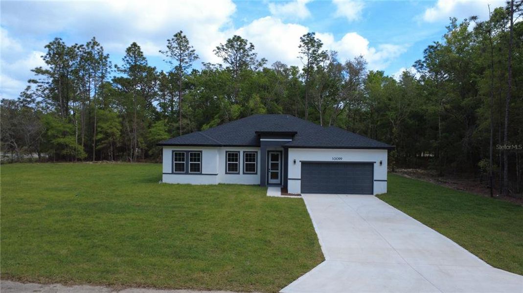 Front exterior of a new home in , Citrus Springs, FL, highlighting curb appeal (Image 2). Front exterior of a new home in , Citrus Springs, FL, highlighting curb appeal (Image 2).