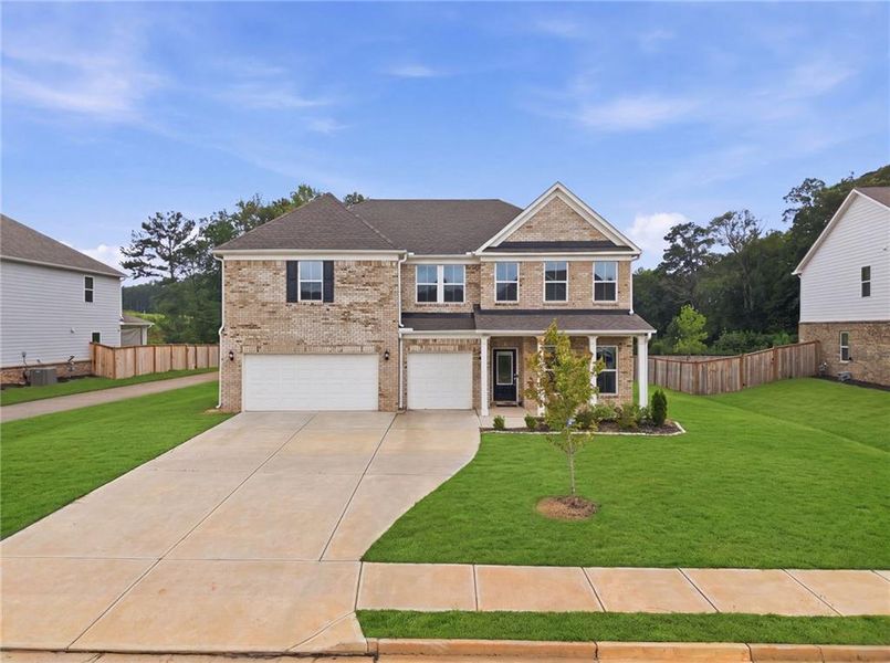 Front exterior of a new home in , McDonough, GA, highlighting curb appeal (Image 32). Front exterior of a new home in , McDonough, GA, highlighting curb appeal (Image 32).