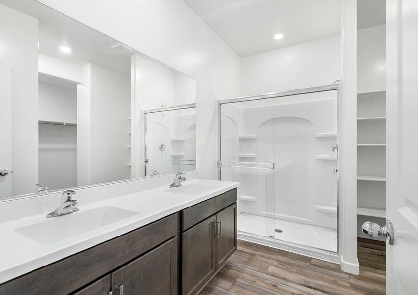 The master bathroom has a beautiful glass-enclosed shower. The master bathroom has a beautiful glass-enclosed shower.