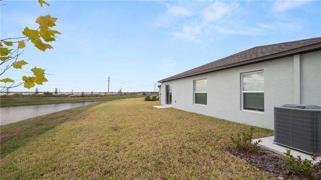 Exterior details and patio area of a home in Cypress Point at Lake Parker: The Estates, Lakeland (Image 4).