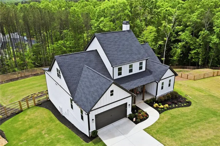 Front exterior of a new home in , Canton, GA, highlighting curb appeal (Image 24).