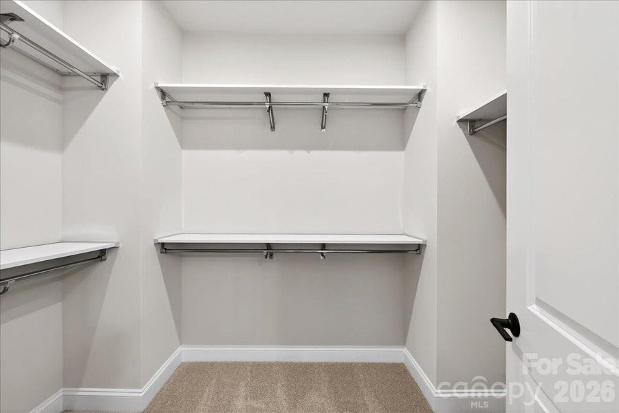 Walk-in closet with upgraded shelving