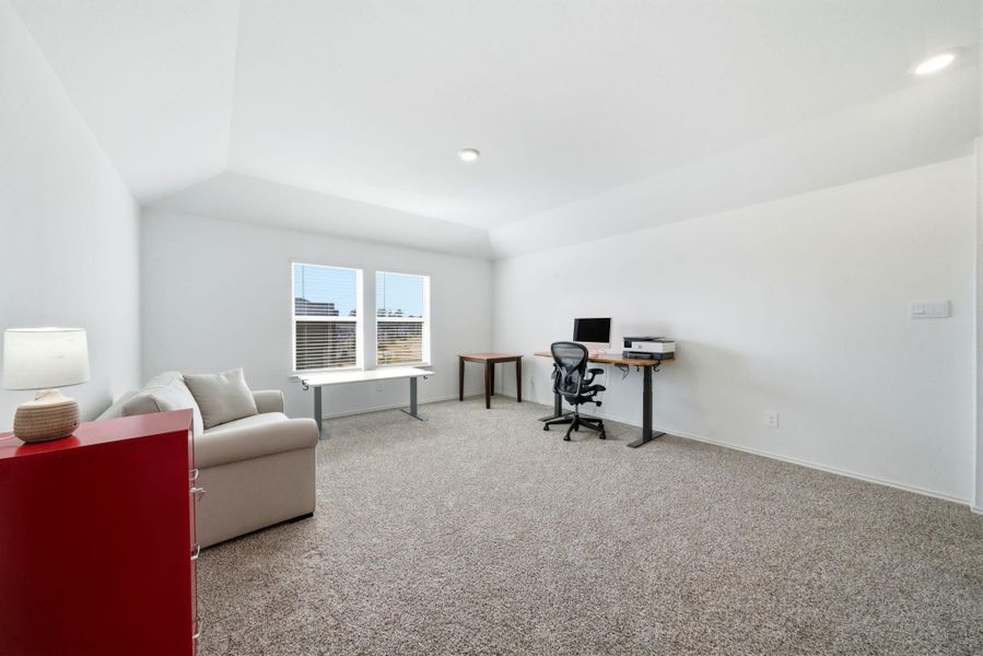 Bright and spacious upstairs game room—perfect for games, movies, endless family fun, and/or a second office space.