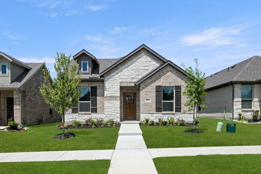 Front exterior of a new home in Redden Farms – Active Adult, Midlothian, TX, highlighting curb appeal (Image 27). Front exterior of a new home in Redden Farms – Active Adult, Midlothian, TX, highlighting curb appeal (Image 27).