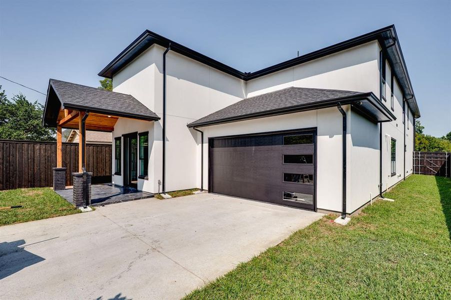 View of front of house with a shingled roof, stucco siding, driveway, and a garage View of front of house with a shingled roof, stucco siding, driveway, and a garage