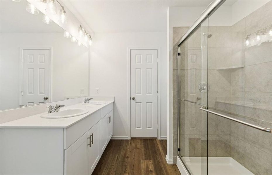 Owner's bathroom features double vanity and large shower Owner's bathroom features double vanity and large shower
