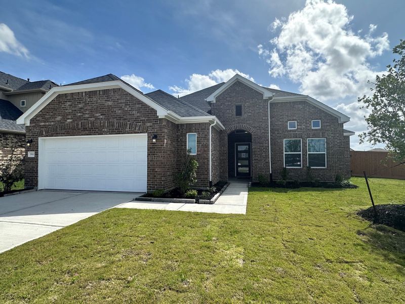 Front exterior of a new home in Rates starting as low as, Iowa Colony, TX, highlighting curb appeal (Image 1). Front exterior of a new home in Rates starting as low as, Iowa Colony, TX, highlighting curb appeal (Image 1).