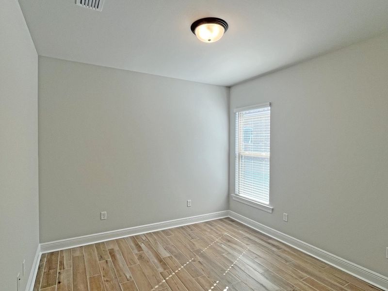 Spacious, unfurnished interior of a new home in Bird Song at Hammock Bay, Freeport (Image 26).