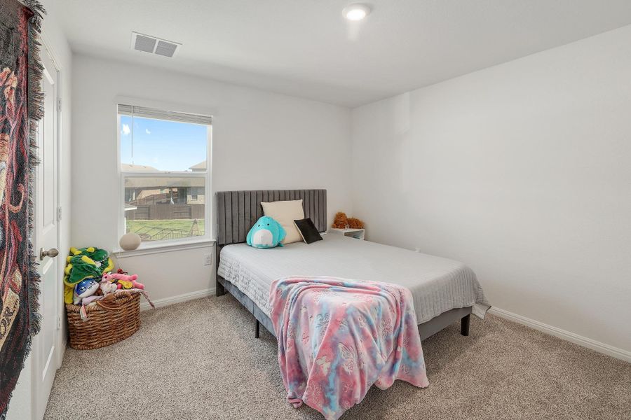 Bright room featuring a single window, recessed ceiling light, white baseboards, and neutral carpet flooring Bright room featuring a single window, recessed ceiling light, white baseboards, and neutral carpet flooring