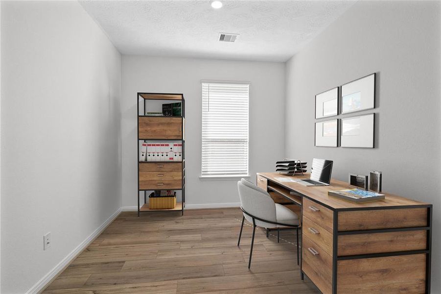 This den is the perfect spot for a home office! Featuring vinyl plank flooring, high ceilings, and a large window with privacy blinds.