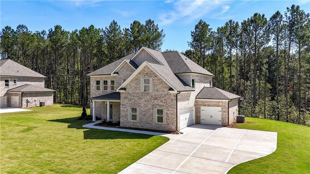 Front exterior of a new home in , Ellenwood, GA, highlighting curb appeal (Image 24).