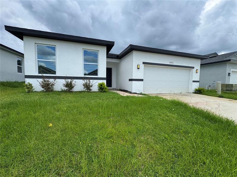 Front exterior of a new home in , Ocala, FL, highlighting curb appeal (Image 1).