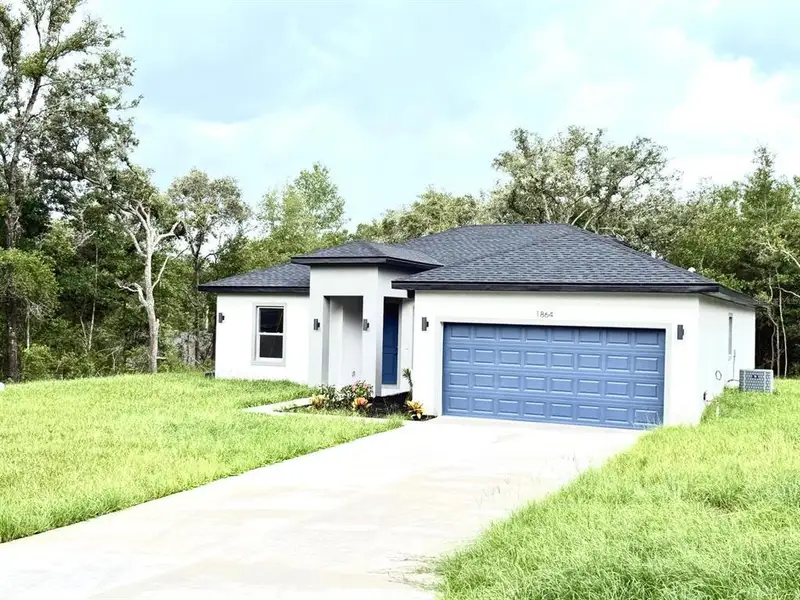 Front exterior of a new home in , Citrus Springs, FL, highlighting curb appeal (Image 2). Front exterior of a new home in , Citrus Springs, FL, highlighting curb appeal (Image 2).