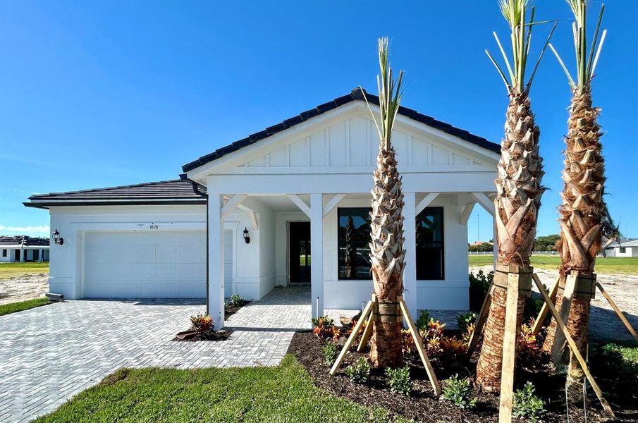Front exterior of a home in the Hendrix Reserve community, located in Lake Worth, FL (Image 3).