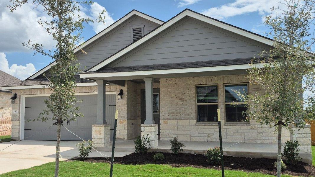 Front exterior of a new home in Creekfall, Burnet, TX, highlighting curb appeal (Image 2). Front exterior of a new home in Creekfall, Burnet, TX, highlighting curb appeal (Image 2).