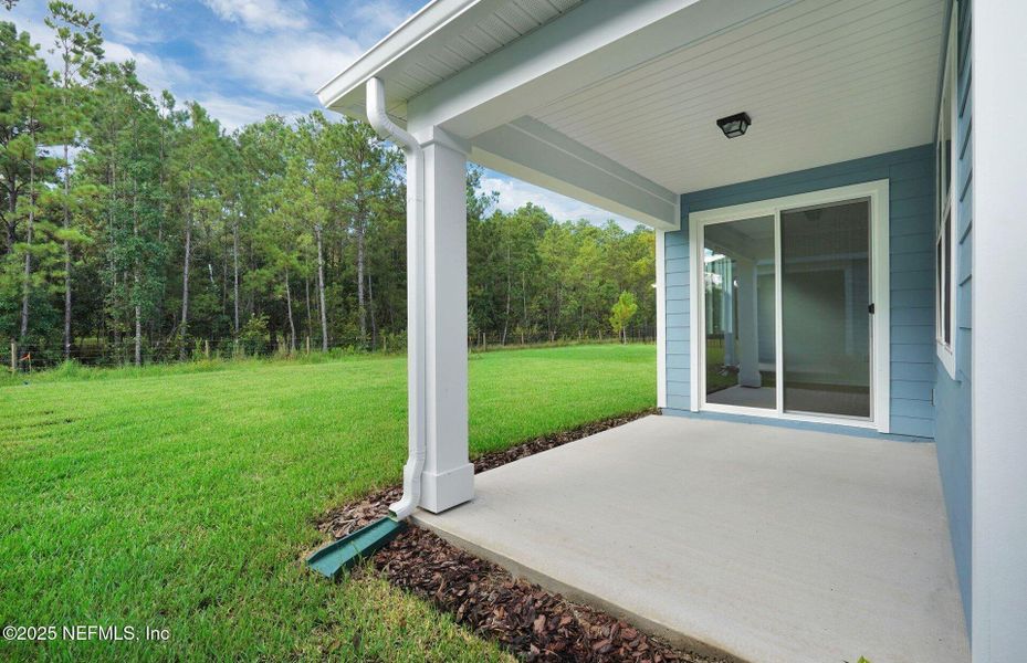 Front exterior of a new home in Hyland Trail, Green Cove Springs, FL, highlighting curb appeal (Image 1).
