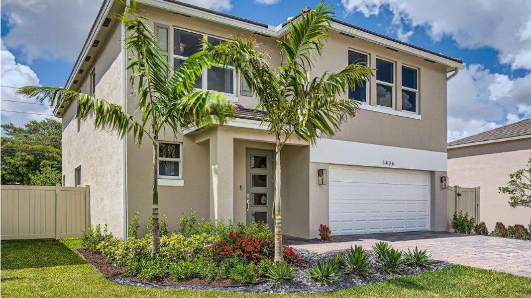 Representative exterior photo of a completed home built from the Grandcourt by D.R. Horton in Parker Pointe, Homestead, FL (Image 2).