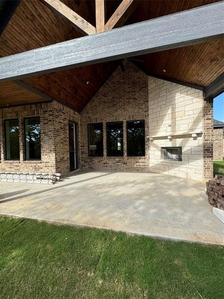 View of patio / terrace featuring an outdoor stone fireplace View of patio / terrace featuring an outdoor stone fireplace