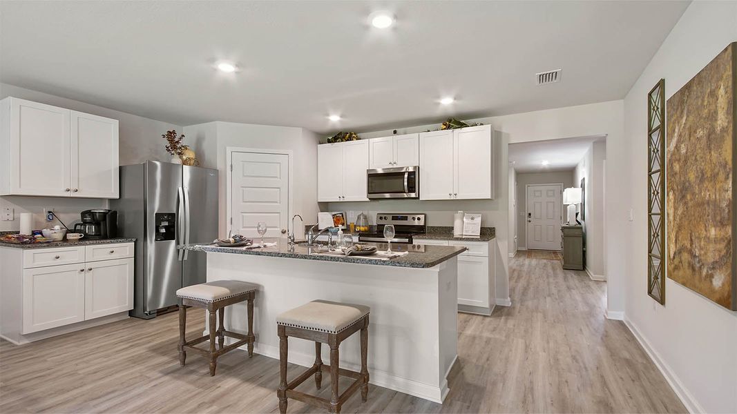 Representative furnished interior of a home built from the Cali by D.R. Horton in Owl's Head East, Freeport (Image 8).