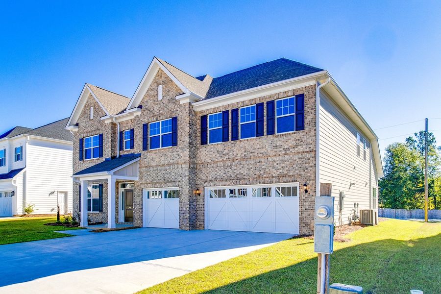 Front exterior of a new home in Palmetto Shores, Chapin, SC, highlighting curb appeal (Image 2).