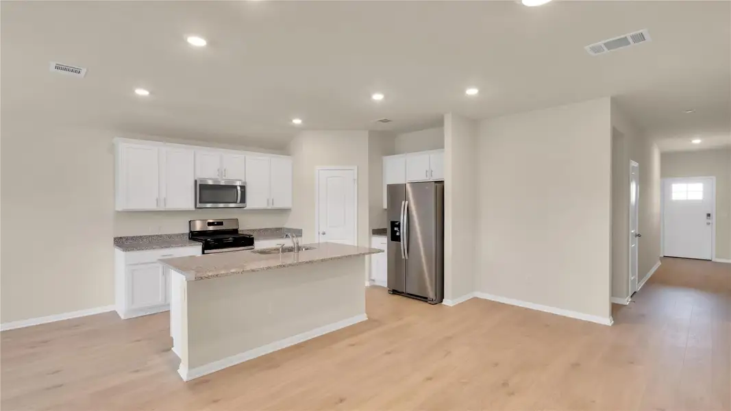 Furnished interior view inside a new home in Bar W Ranch, Leander (Image 3). Furnished interior view inside a new home in Bar W Ranch, Leander (Image 3).