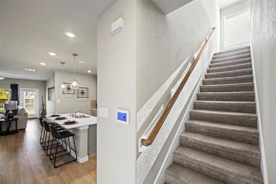 Carpeted staircase leading to the upper level.