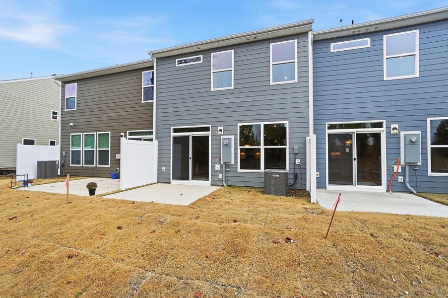 Exterior details and patio area of a home in Harrisburg Village Townhomes, Harrisburg (Image 30).