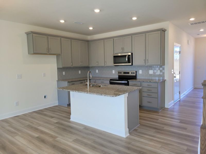 Furnished interior view inside a new home in 1158 Place Townhomes, Wilson (Image 6).