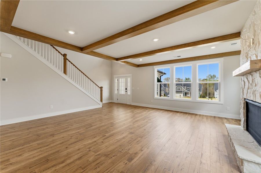 This living room features rich wood floors, a cozy