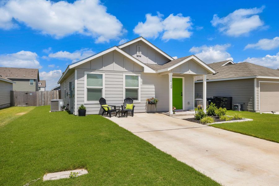 Front exterior of a new home in Rancho Del Cielo, Jarrell, TX, highlighting curb appeal (Image 1). Front exterior of a new home in Rancho Del Cielo, Jarrell, TX, highlighting curb appeal (Image 1).