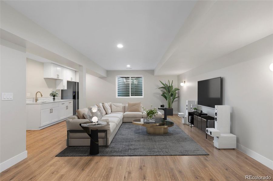 Spacious lower level living and rec room withfull wet bar (virtually staged to show designoptions) Spacious lower level living and rec room withfull wet bar (virtually staged to show designoptions)