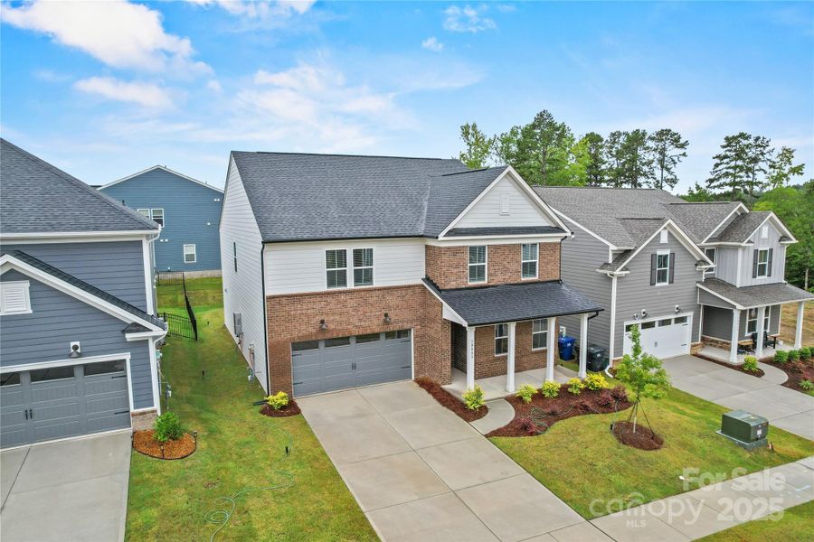 Front exterior of a new home in Bryton, Huntersville, NC, highlighting curb appeal (Image 21). Front exterior of a new home in Bryton, Huntersville, NC, highlighting curb appeal (Image 21).
