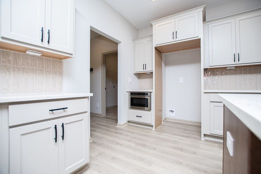 Furnished interior view inside a new home in WOODMONT RESERVE, Roopville (Image 9).